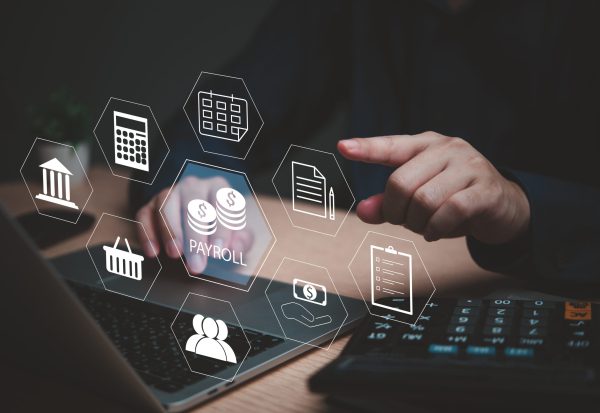 Person,Managing,Payroll,With,Holographic,Icons,For,Salary,,Accounting,,And